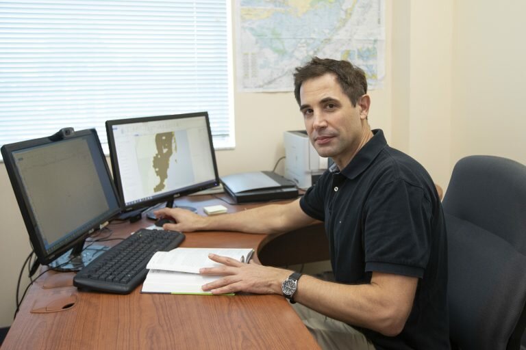 Dr. Henry Hochmair at the UF/IFAS Fort Lauderdale Research and Education Center. working with GIS software.